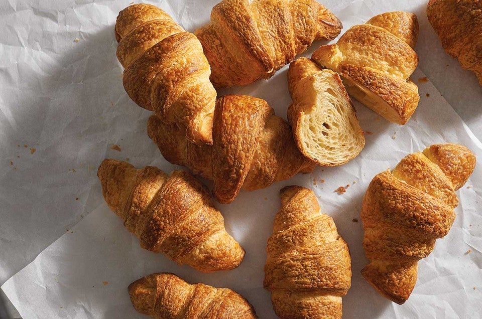 Multiple freshly baked croissants